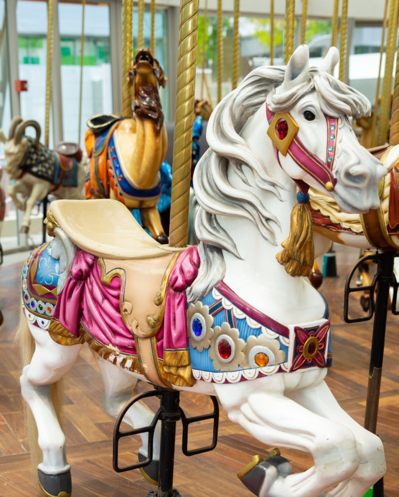 Decorated carousel horse animal inside the Leroy King Historical Carousel