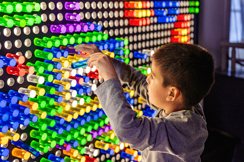 colorful pegs on the giant pegboard