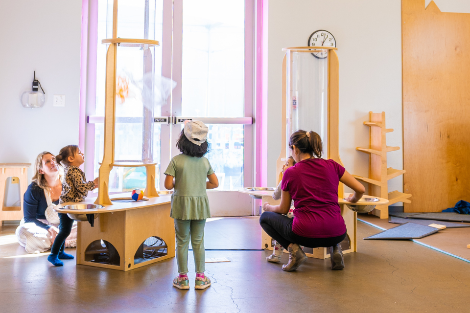 Children playing at the vertical wind tunnels